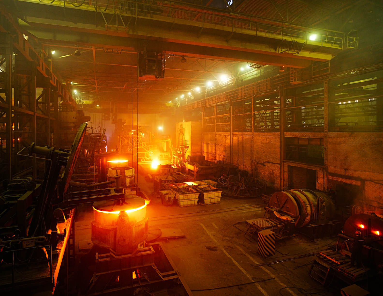 Making iron at steel factory furnace 